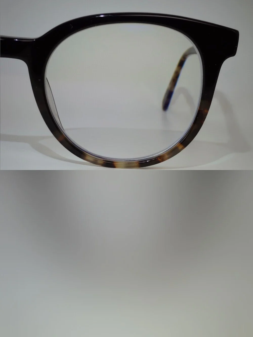 Rialto. Classic Round Black Upper, Animal Print Lower And Temples.